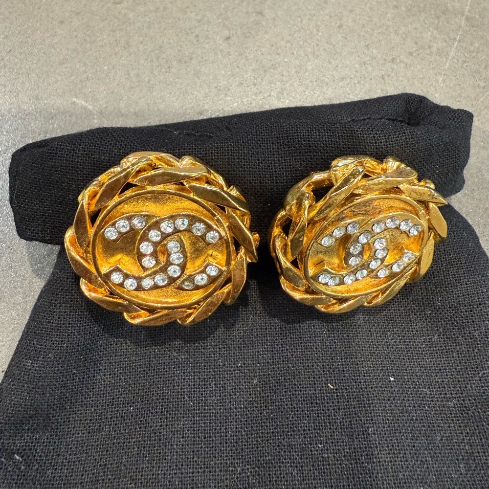 CHANEL Gold-Tone clip earrings with rhinestones.  1 rhinestone missing